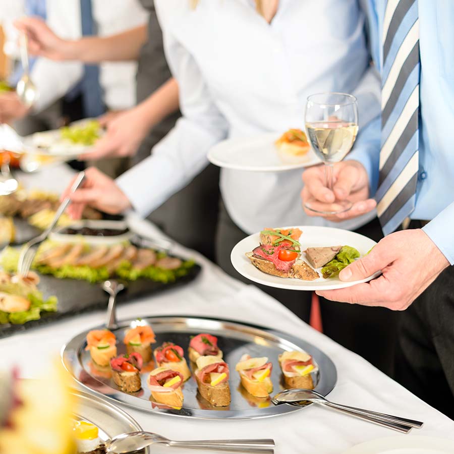 Business people take buffet appetizers Catering at business company event people choosing buffet food