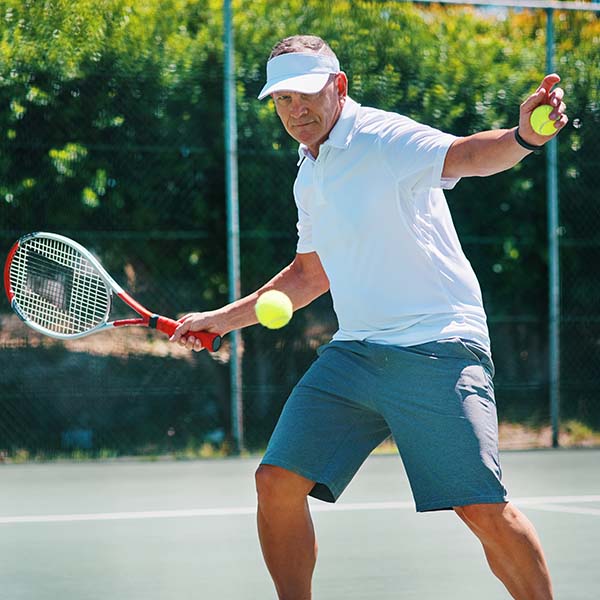 Man serving a tennis ball